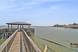 Residents can enjoy the Woodland Shores fishing pier, an ideal spot for casting a line while taking in the beautiful views of Lake Livingston.