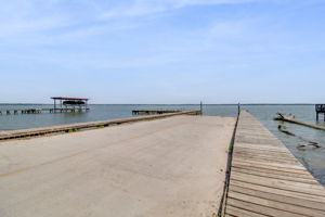 Enjoy easy access to the community boat ramp, located near the property for added convenience.