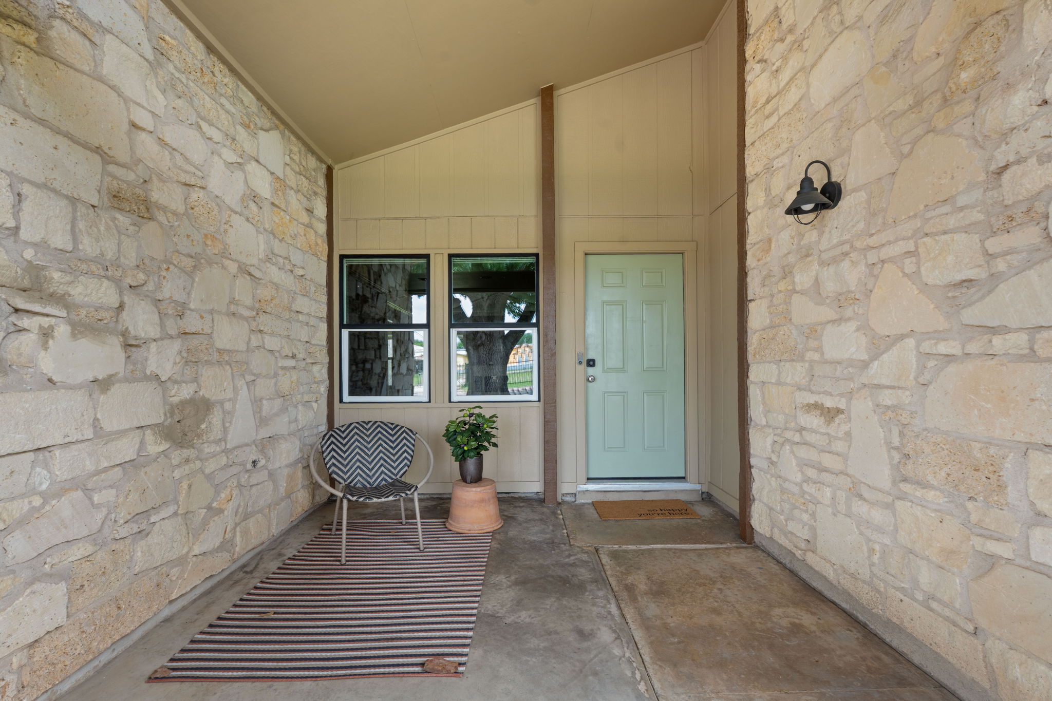 Stylish lines and stone at shady entry