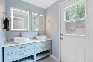 Primary bathroom (the door would make a pool or hot tub so easy to come and go from)