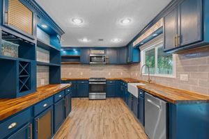 Butcher block counters, a wine fridge and so much prep space