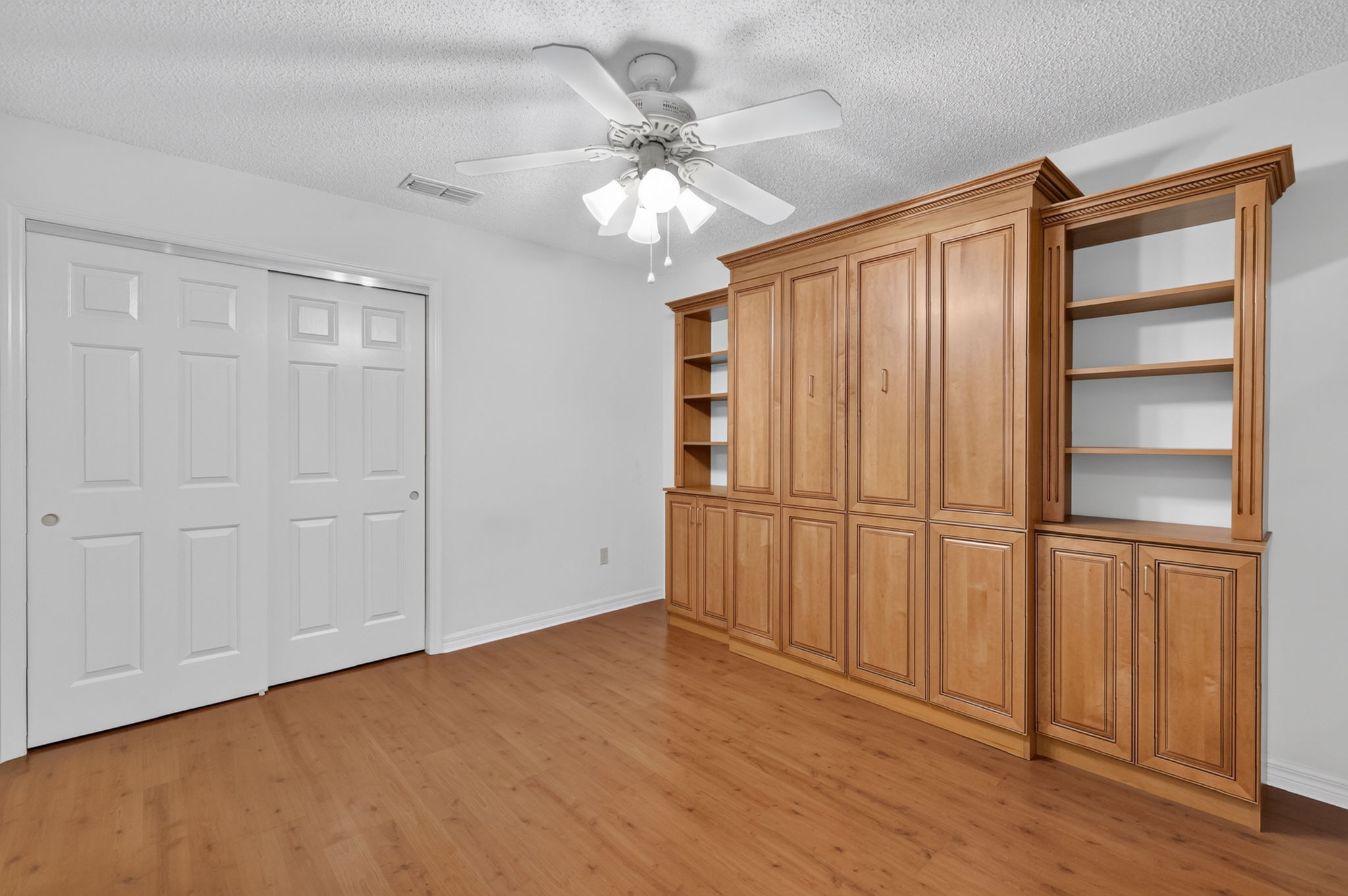 En-Suite Second Bedroom with Custom Murphy Bed and Cabinetry