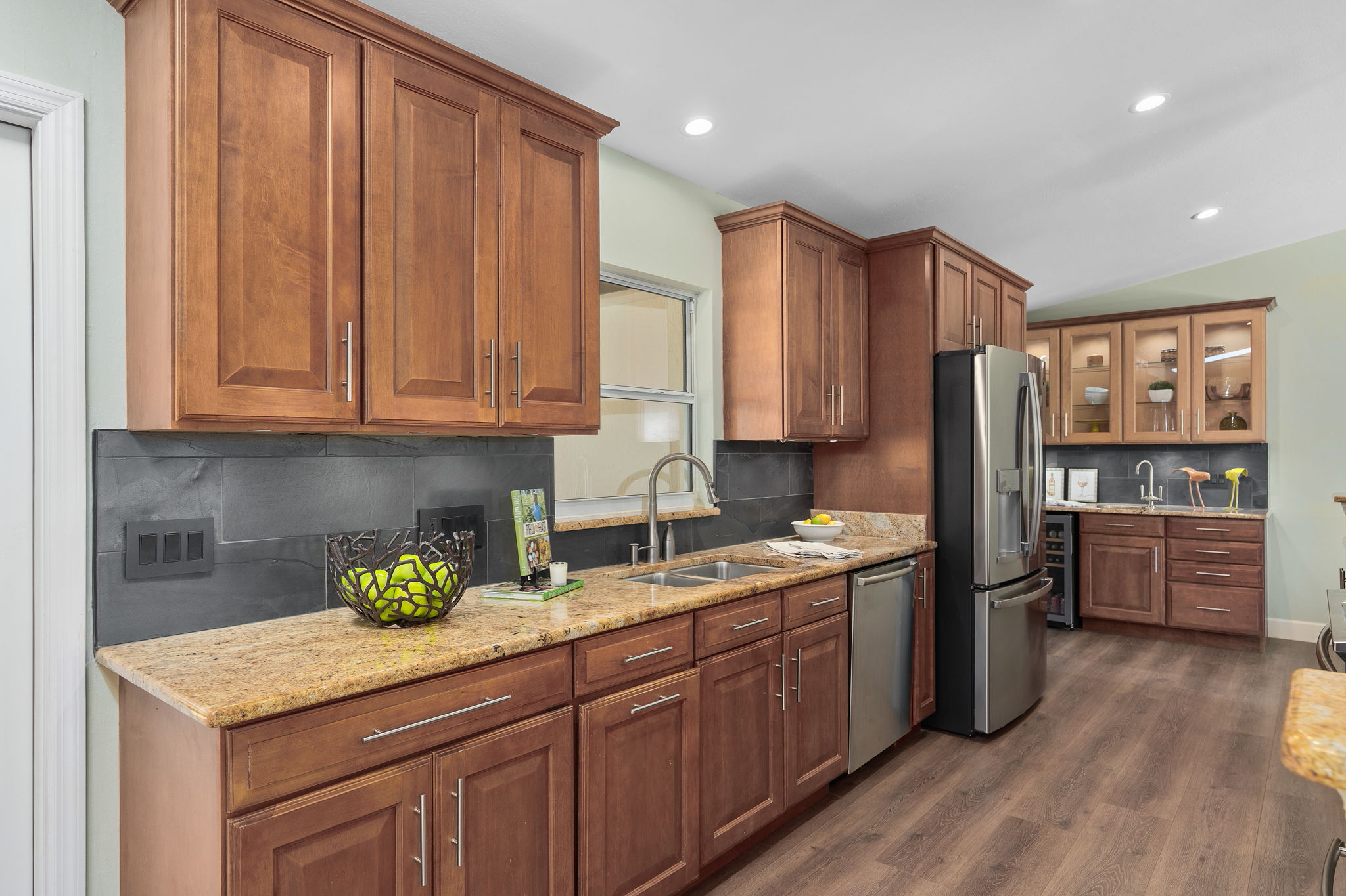 Under cabinet lighting and sleek slate backsplash