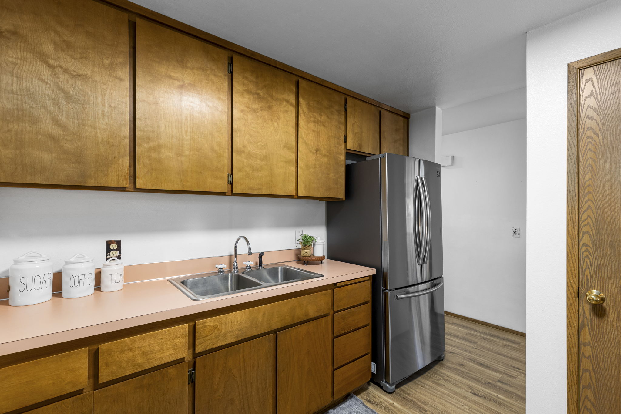 pantry closet in kitchen; stainless steel French door refrigerator