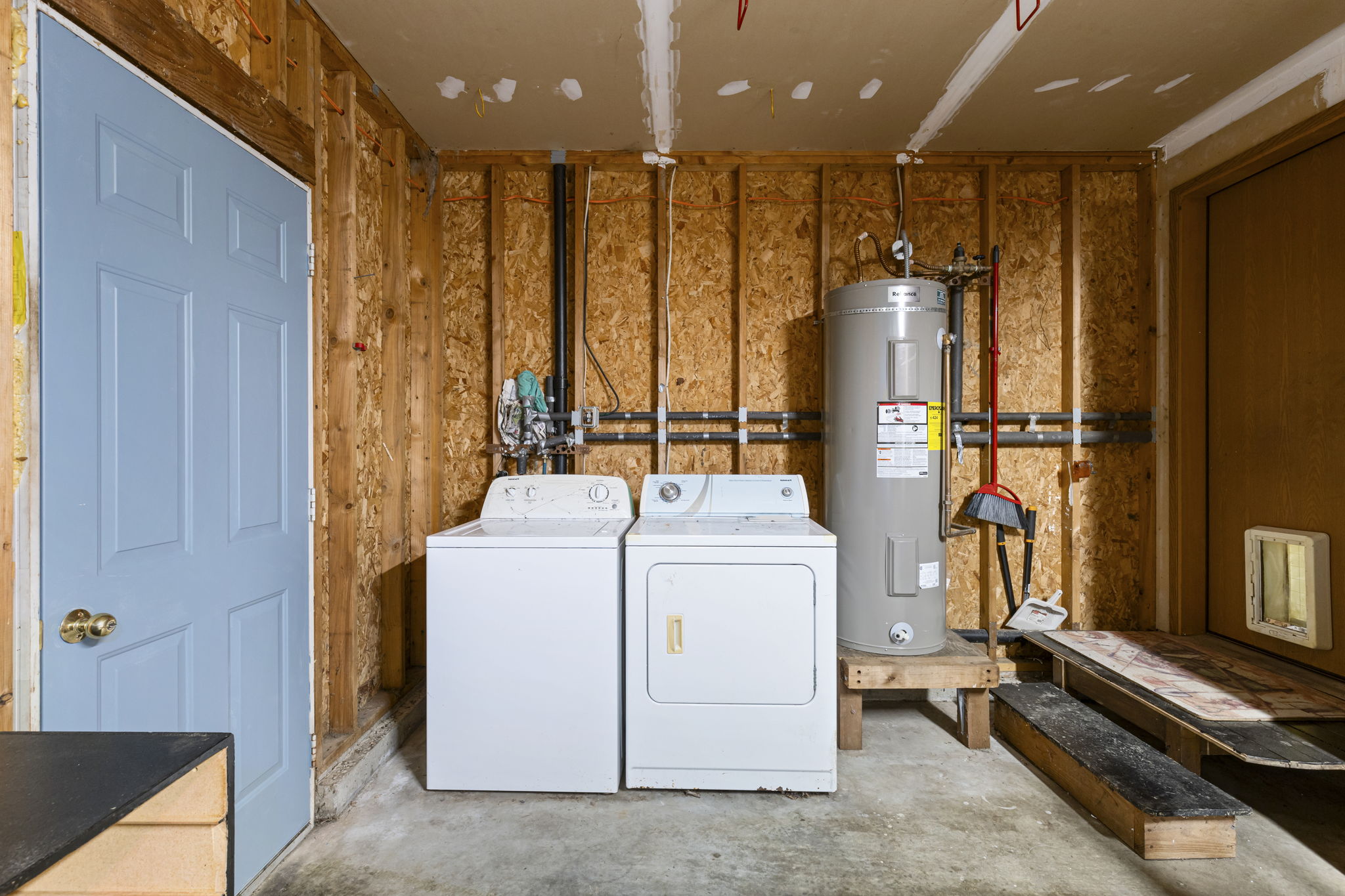 washer & dryer in attached garage; door leads to fenced-in yard