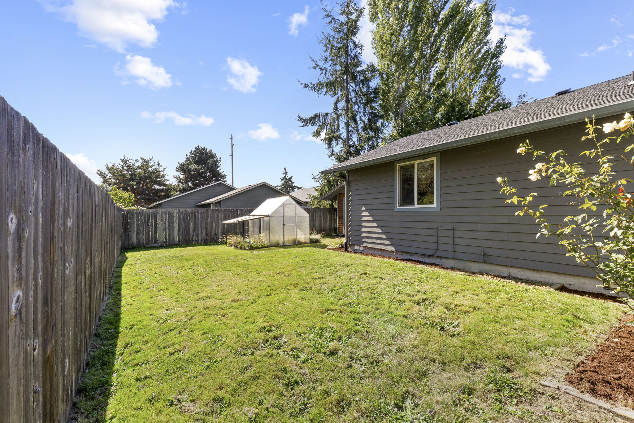 fully-fenced side and backyard