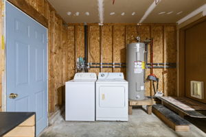 washer & dryer in attached garage; door leads to fenced-in yard