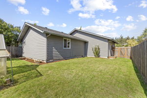 fully-fenced, spacious back and side yard