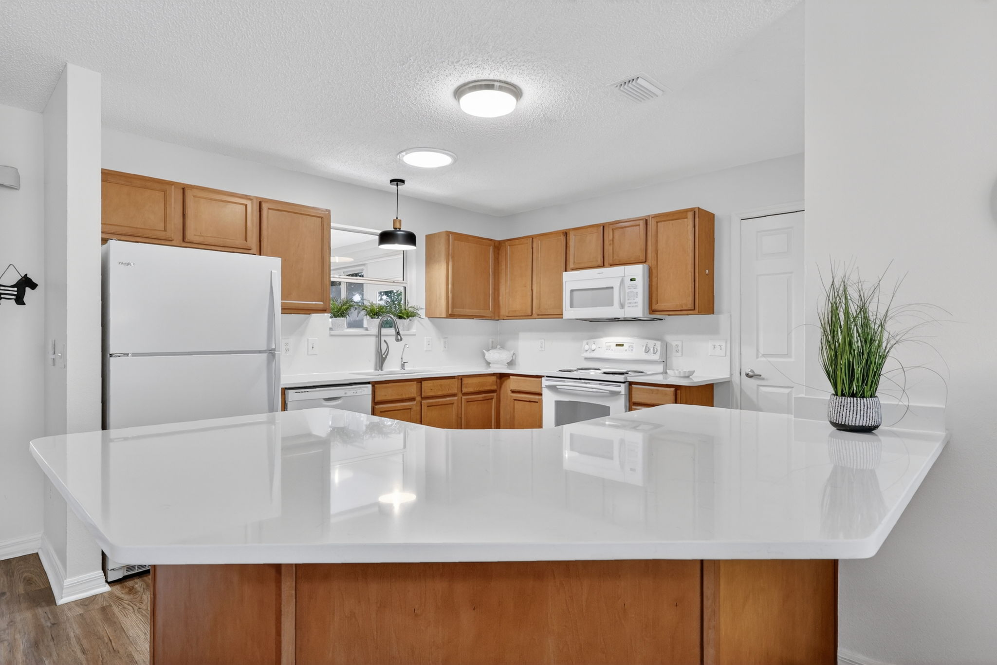 Kitchen with NEW QUARTZ countertops and full backsplash!