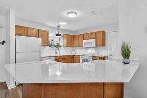 Kitchen with NEW QUARTZ countertops and full backsplash!