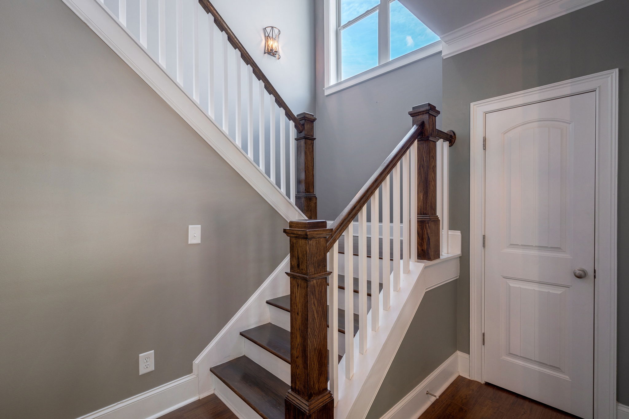 Wood stairs to second floor & coat closet