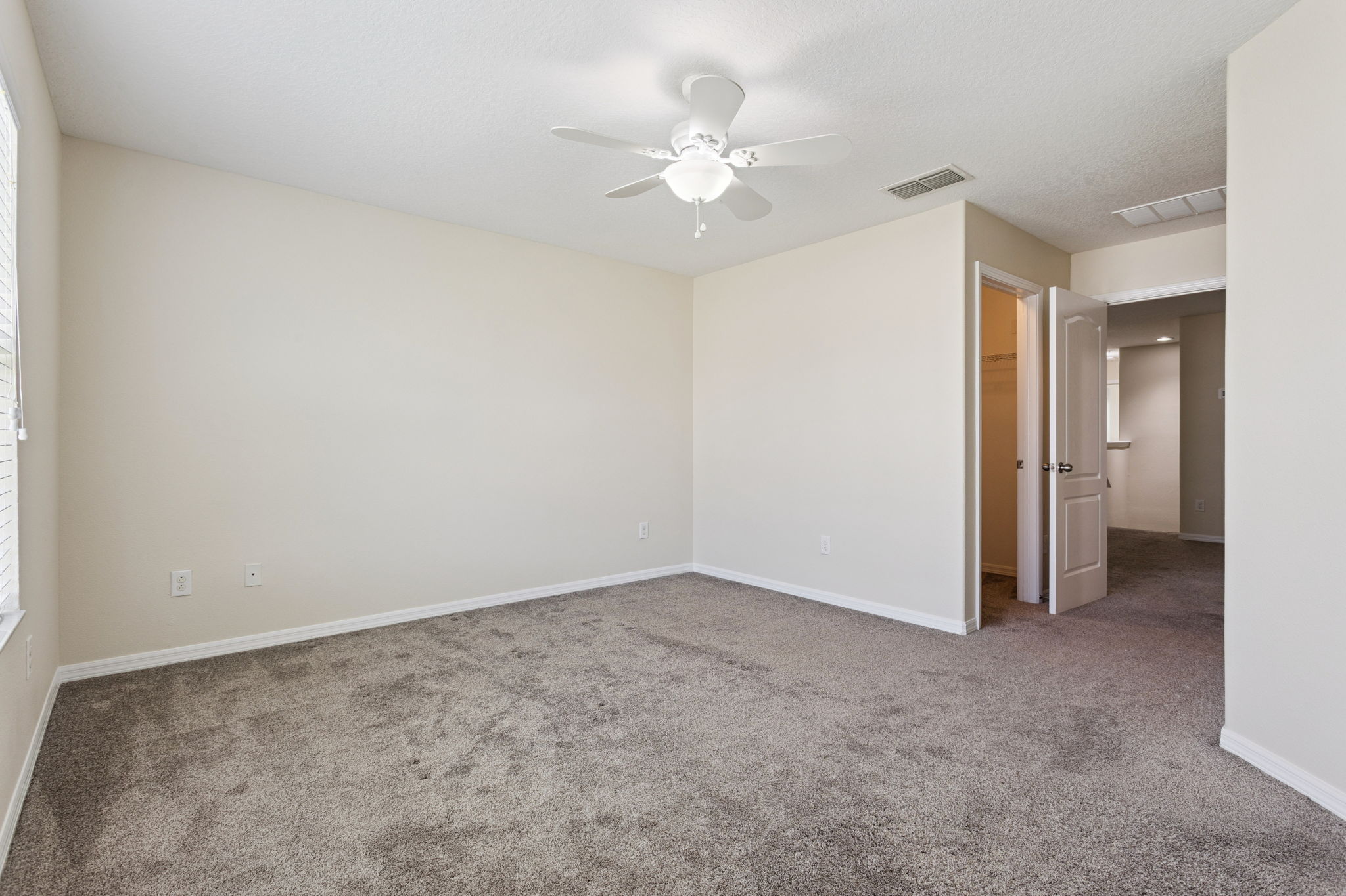 primary suite with 2 walk in closets