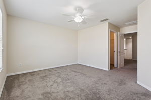 primary suite with 2 walk in closets