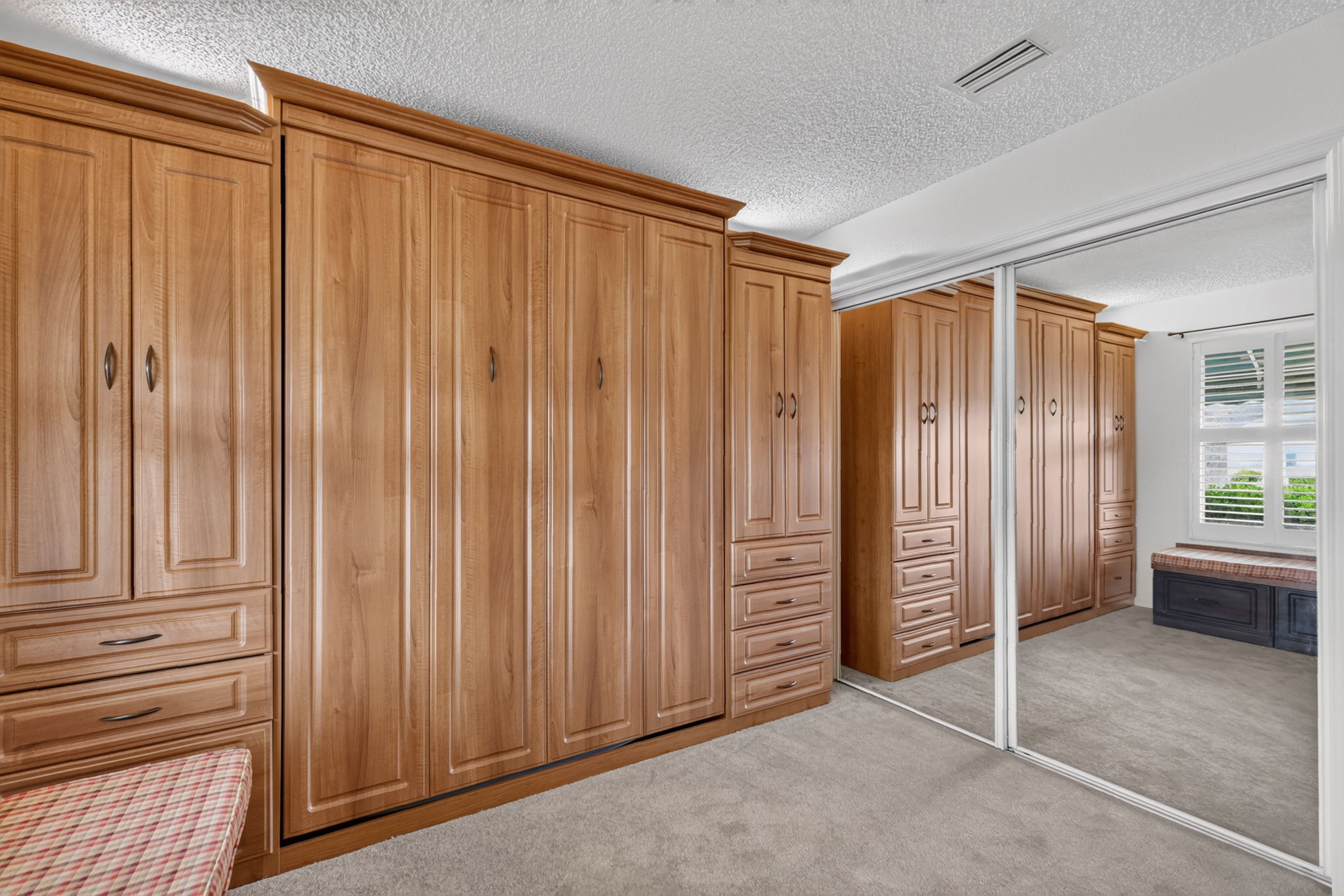 Second Bedroom with Murphy Bed, Built-In Desk, and Bench
