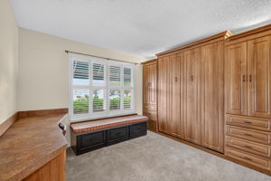 Second Bedroom with Murphy Bed, Built-In Desk, and Bench