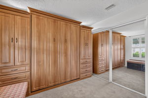 Second Bedroom with Murphy Bed, Built-In Desk, and Bench