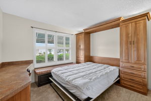Second Bedroom with Murphy Bed, Built-In Desk, and Bench