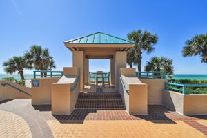 Common Area Exterior Patio Featuring Hightop Table; Perfect for Sunset Views Over the Water
