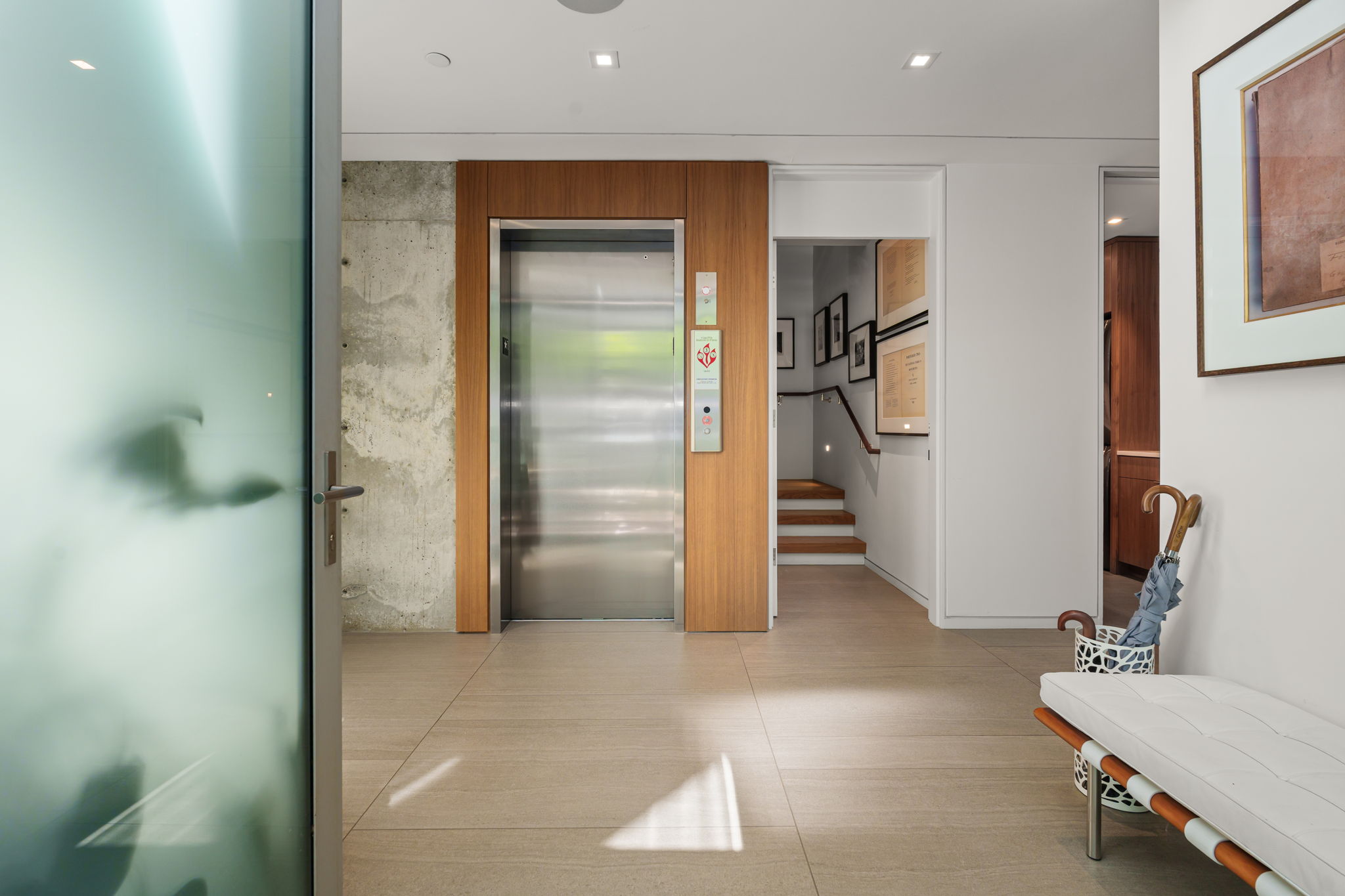 First floor: Studio/flex space, half bathroom, private courtyard, laundry room, two-car garage and mechanical room.