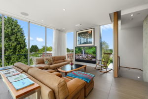 Living room with gas fireplace behind TV