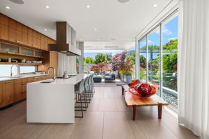 Light-filled kitchen opens seamlessly to large outdoor patio.