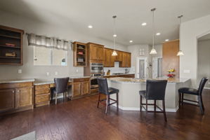 Kitchen with bar seating and desk