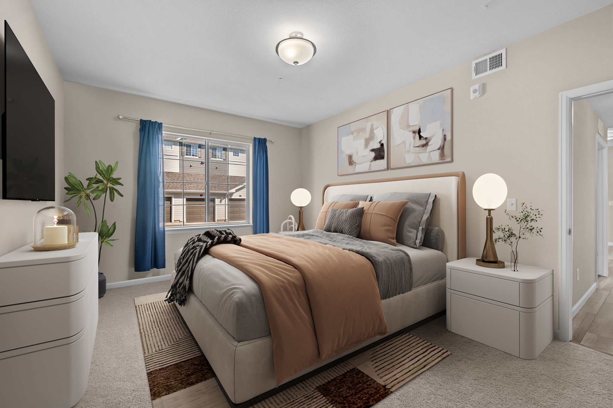 Virtually staged primary bedroom with upgraded carpet pad and large window for extra light