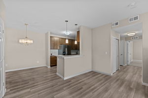 View of Hallway, family room, dining room and kitchen
