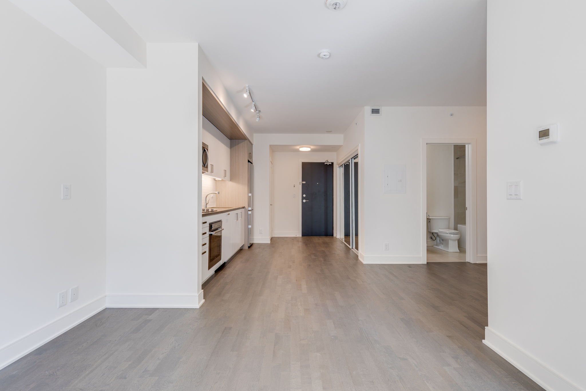 Open concept living room kitchen den