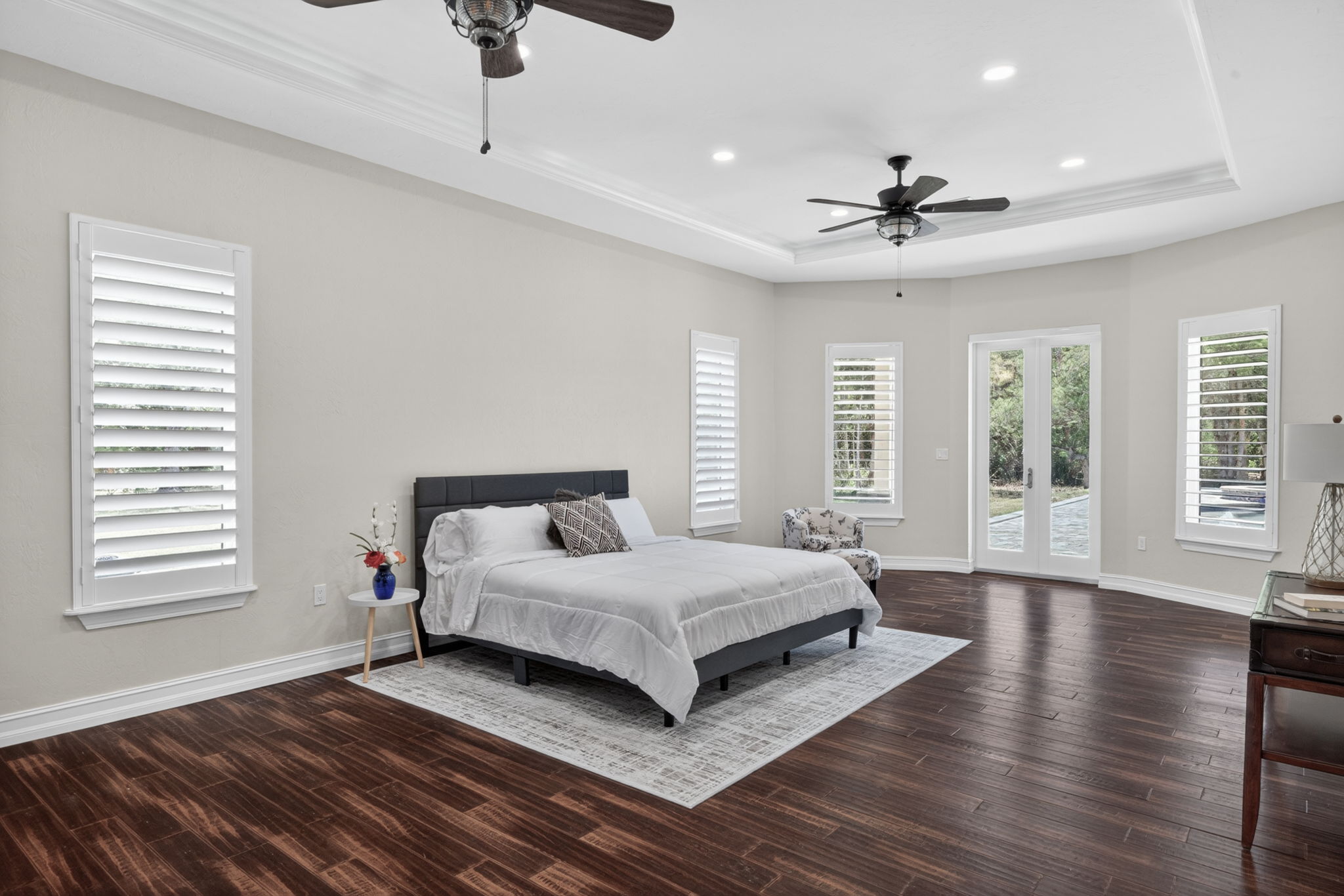 Primary Bedroom overlooks the resort style pool area.