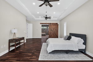 Primary Bedroom with custom barn doors.