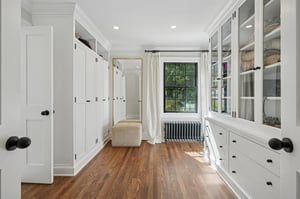 Walk-in dressing room with lots of organization.
