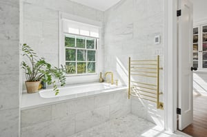 Luxuriate in your primary tub.  There's also an oversized shower.