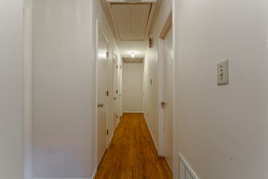 Hallway to Bedrooms w/ Hardwood Floors