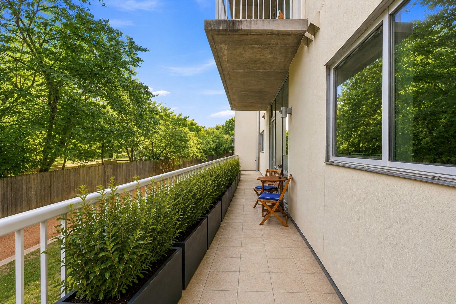 Private Terrace - showing planter boxes to add privacy (AI).