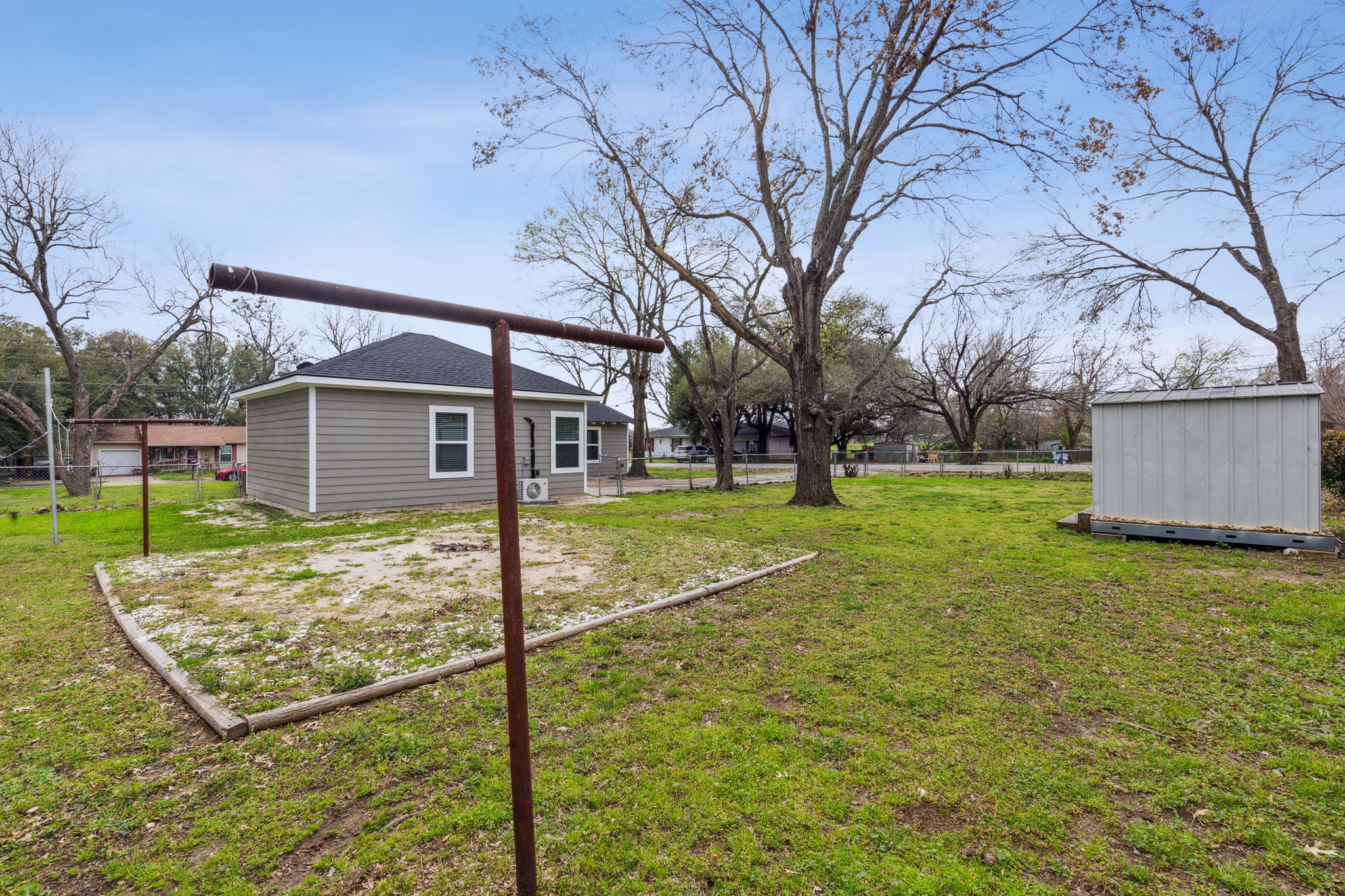 Large fenced backyard with additional gated entry to park cars, work trailers, or boats.