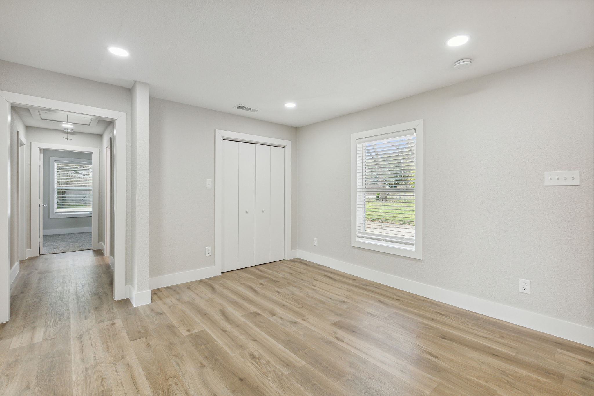 Dining area with additional storage area with built in shelves.