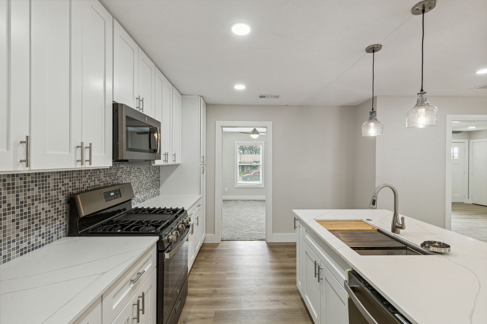 Quartz countertops, new cabinets, and all new stainless steel applicances
