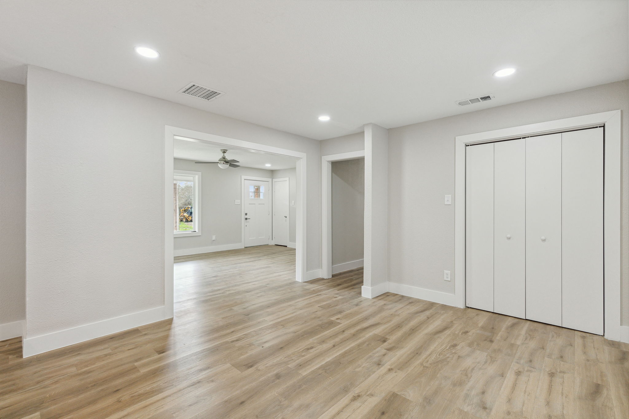 Open living, dining, and kitchen.