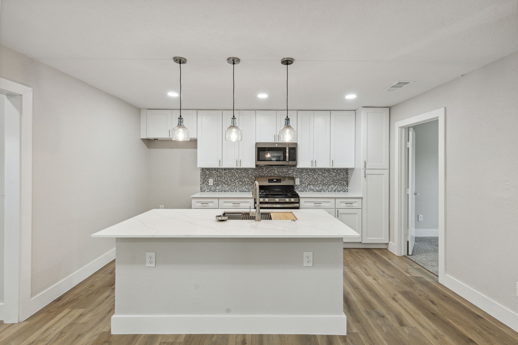 Quartz countertops, new cabinets, and all new stainless steel applicances