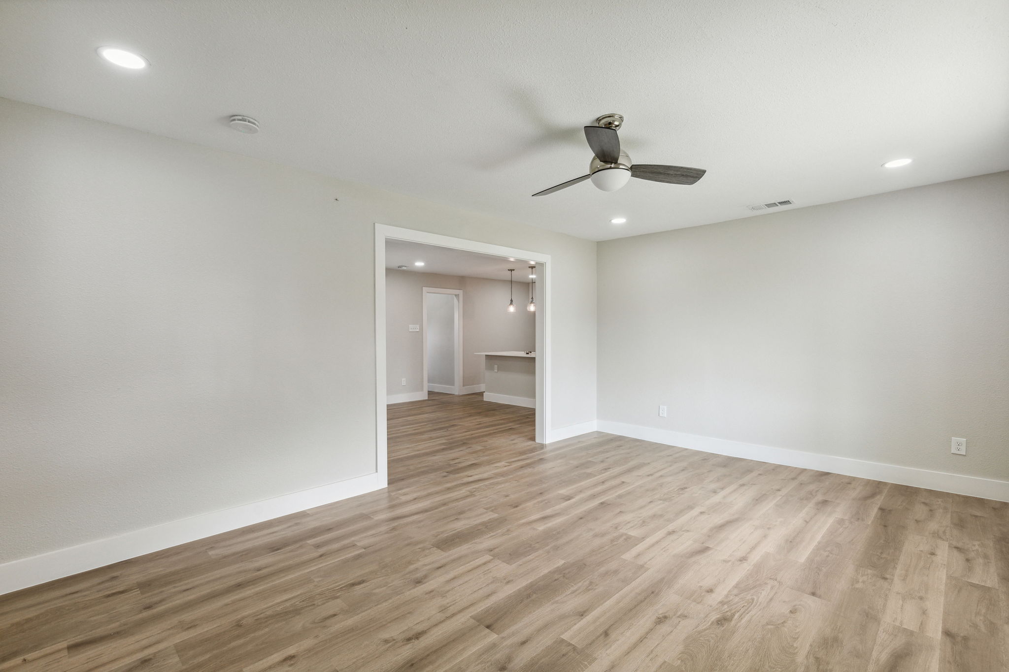 Open living, dining, and kitchen.