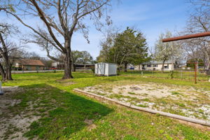 Large fenced backyard with additional gated entry to park cars, work trailers, or boats.