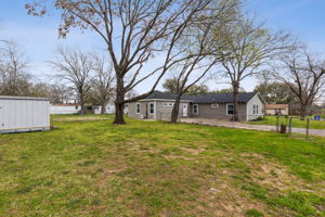 Large fenced backyard with additional gated entry to park cars, work trailers, or boats.