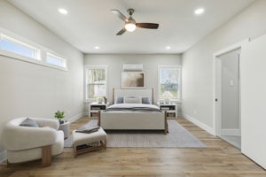 Spacious primary bedroom with ample sitting area.