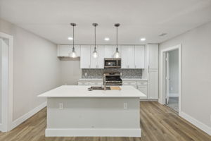 Quartz countertops, new cabinets, and all new stainless steel applicances