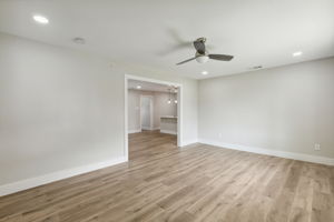 Open living, dining, and kitchen.
