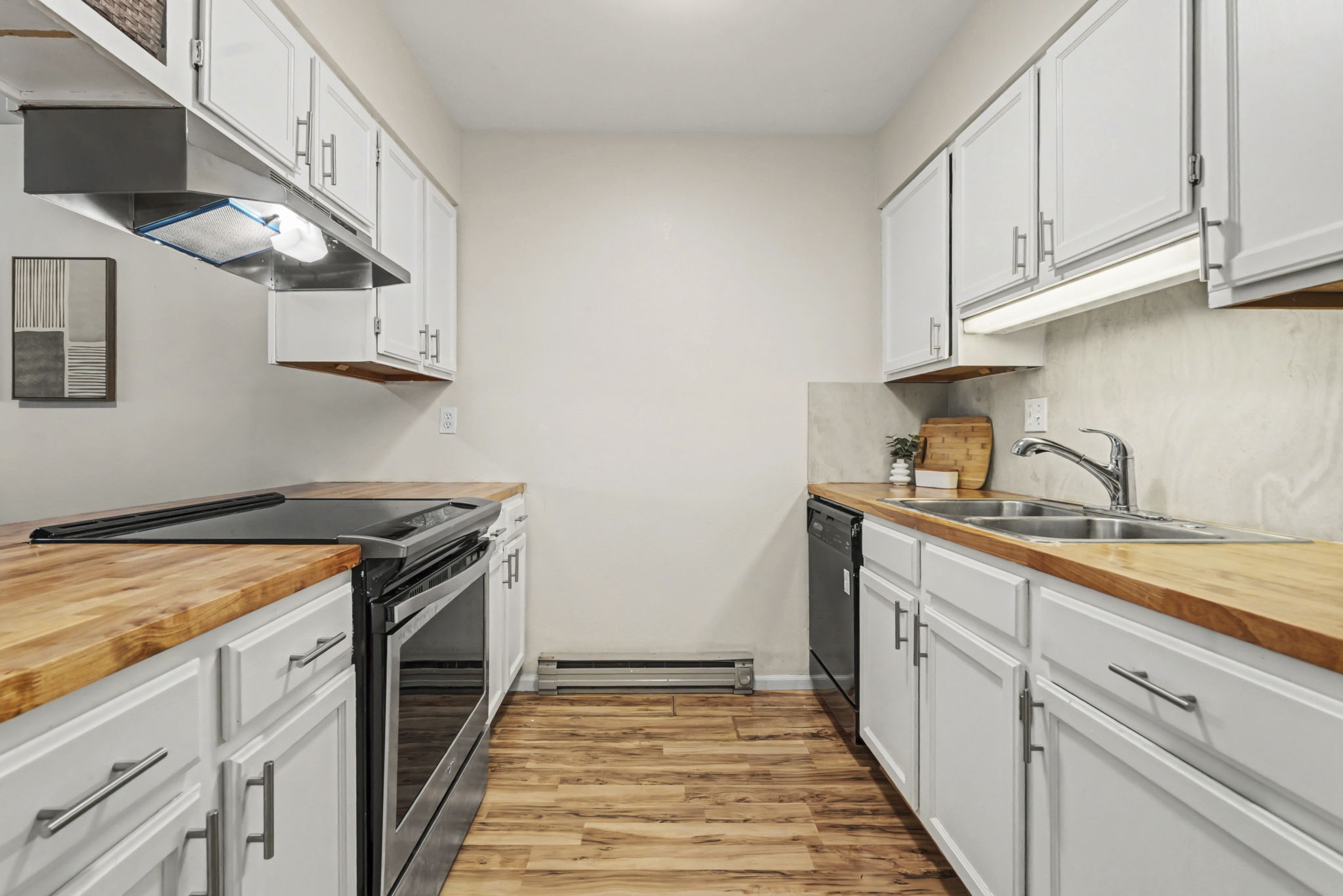 Kitchen opens to living and dining room