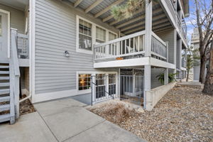 Step down to the privacy of a garden level condo with a covered front porch