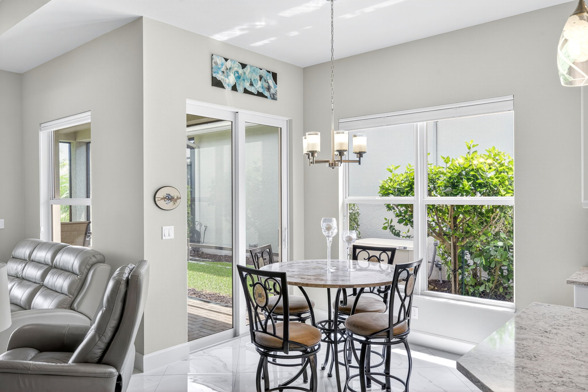 Breakfast area open to covered lanai with lake views.