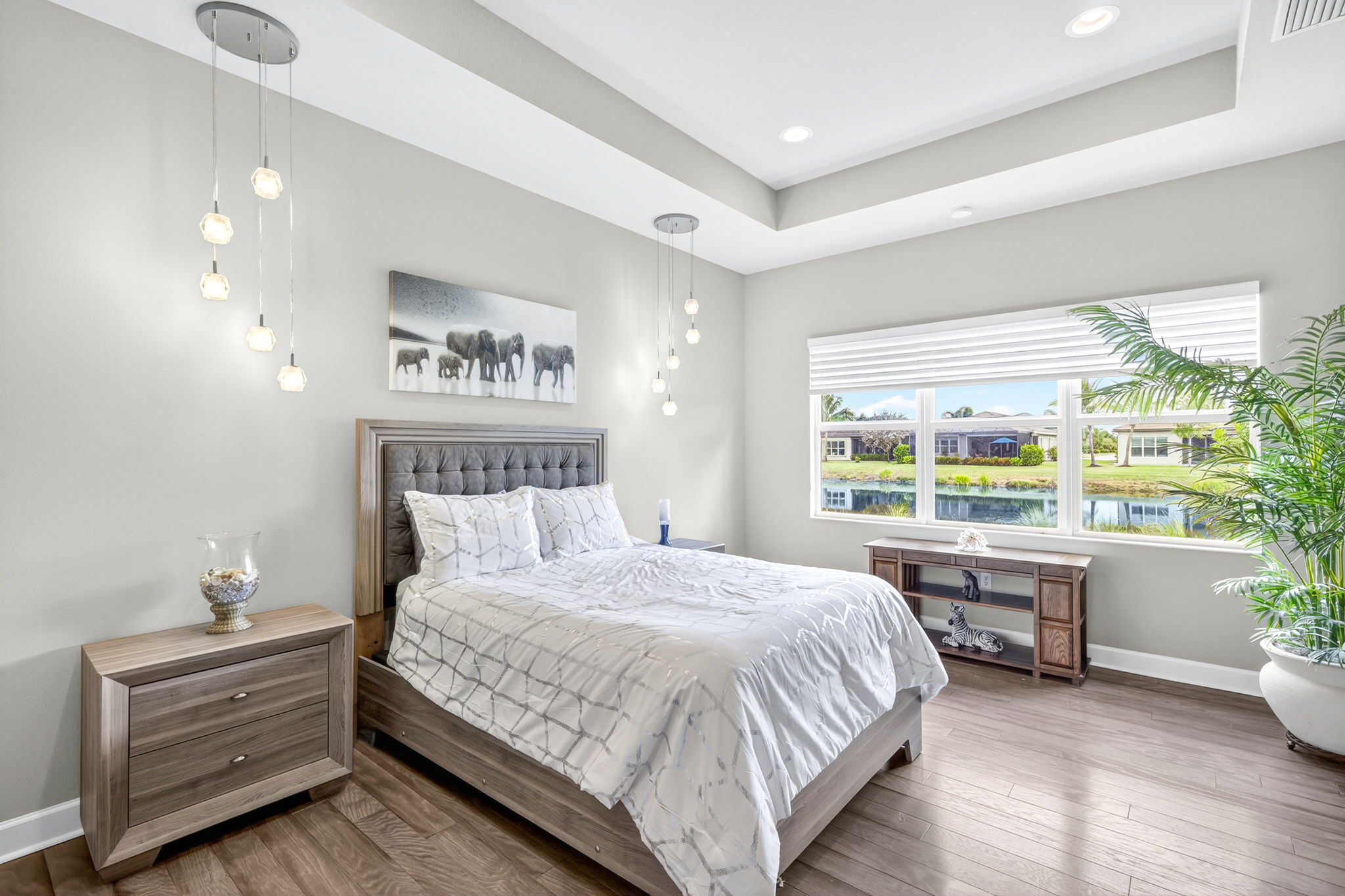 Direct lake view from primary suite with tray ceiling.